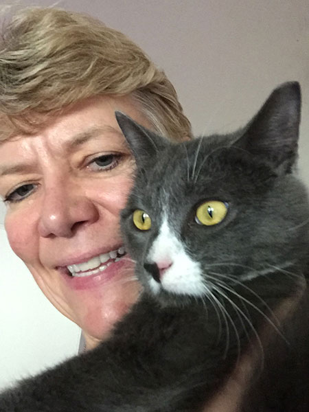 Rene holding black and white cat